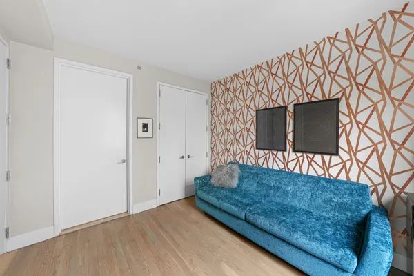 a living room with a couch and a flat screen tv