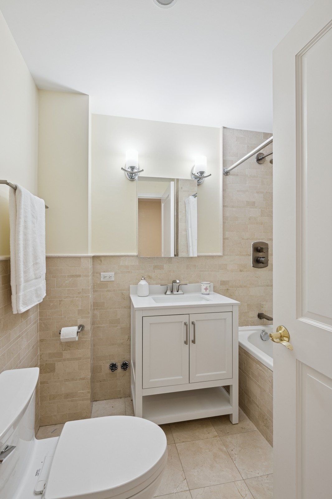 514 West End Avenue, Unit 8/9A Manhattan, NY 10024 - Photo 23 of 24 a bathroom with a sink a toilet and mirror