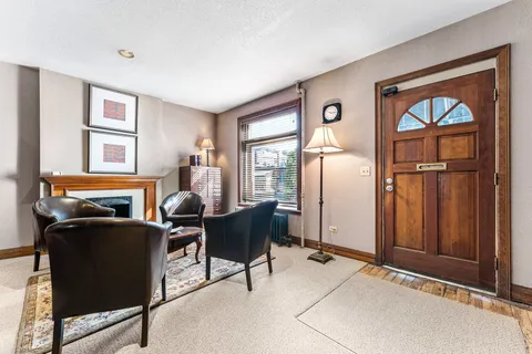 a view of a livingroom with furniture and a window