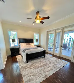 a bathroom with a shower sink vanity mirror and toilet