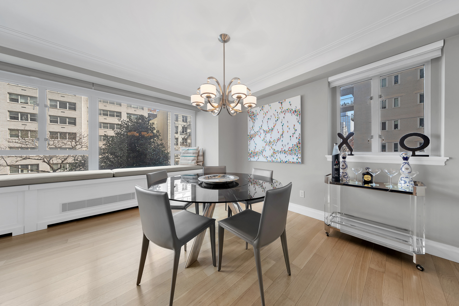 200 East 66th Street, Unit A407 Manhattan, NY 10065 - Photo 3 of 24 a dining room with furniture and window