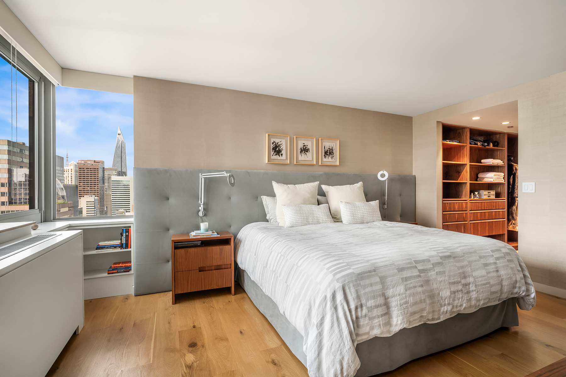 235 East 55th Street, Unit 44B Manhattan, NY 10022 - Photo 6 of 12 a bedroom with a large bed and a large window