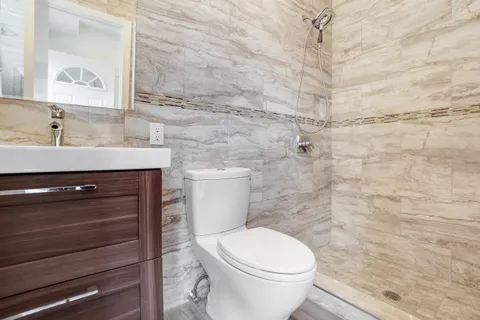 a bathroom with a toilet and a sink