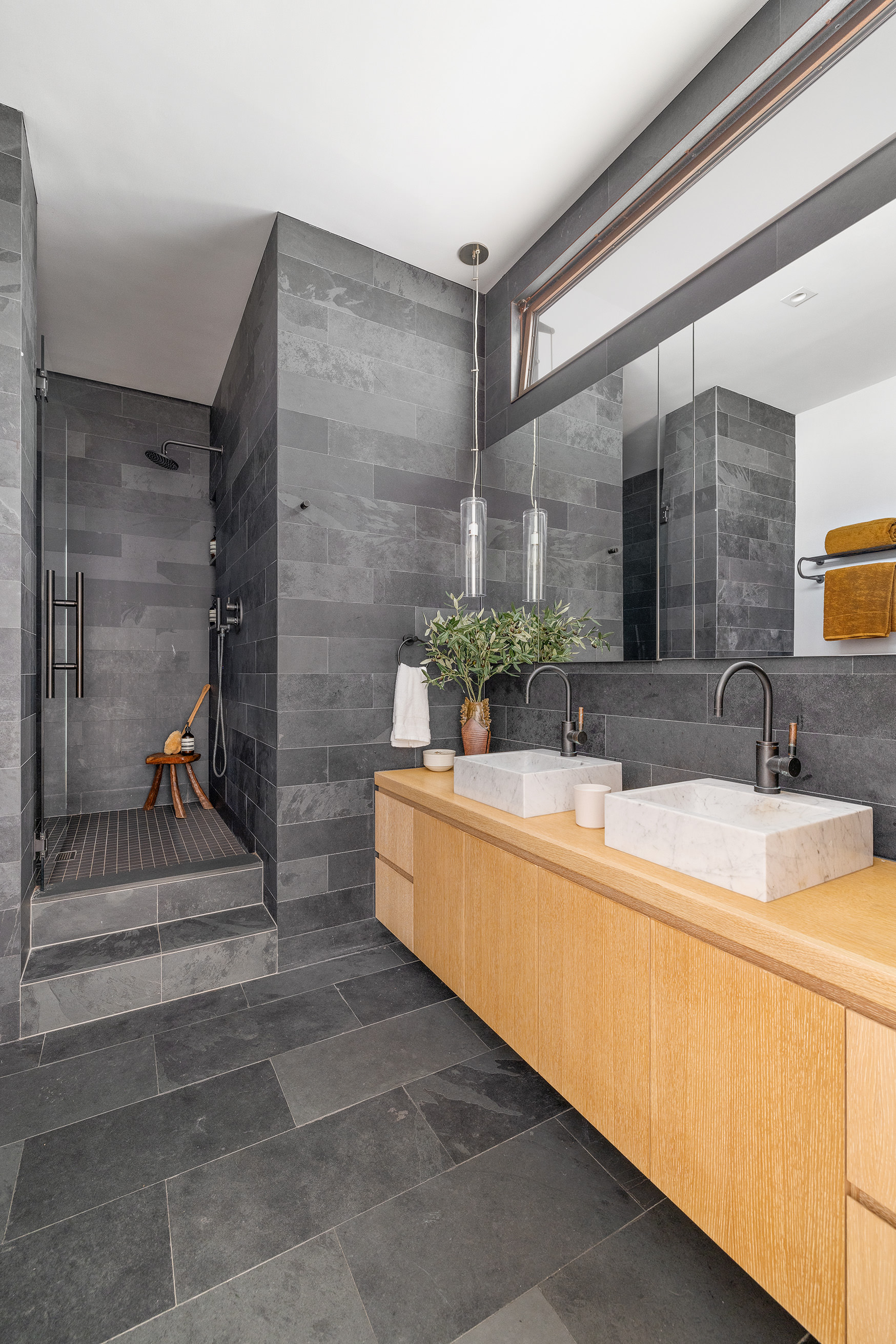 250 Mercer Street, Unit B706B707 Manhattan, NY 10012 - Photo 19 of 25 a bathroom with a double vanity sink and a mirror