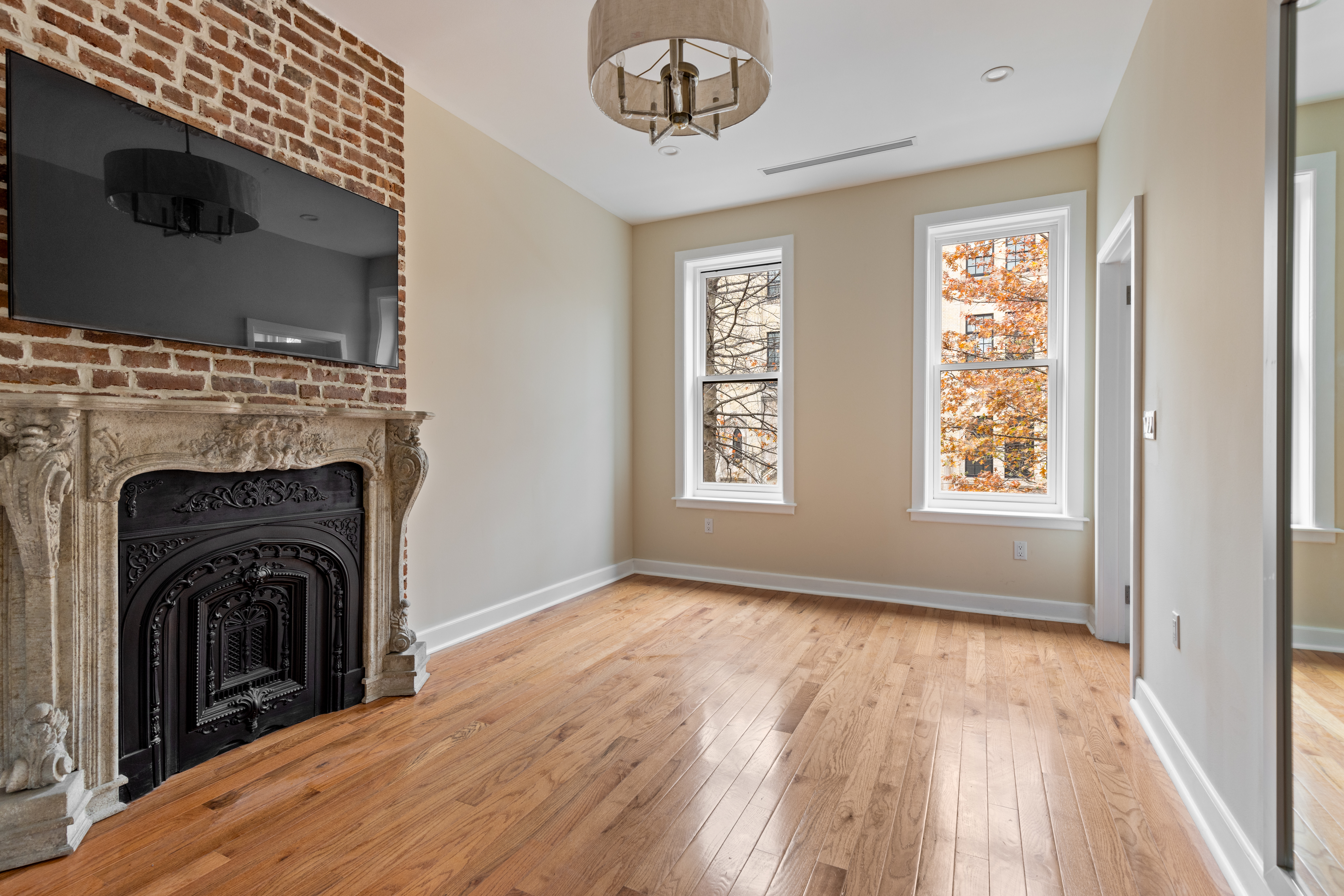 185 Bainbridge Street Brooklyn, NY 11233 - Photo 19 of 23 a view of a livingroom with washer and dryer