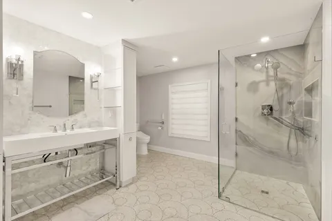 a bathroom with a shower curtain and a sink