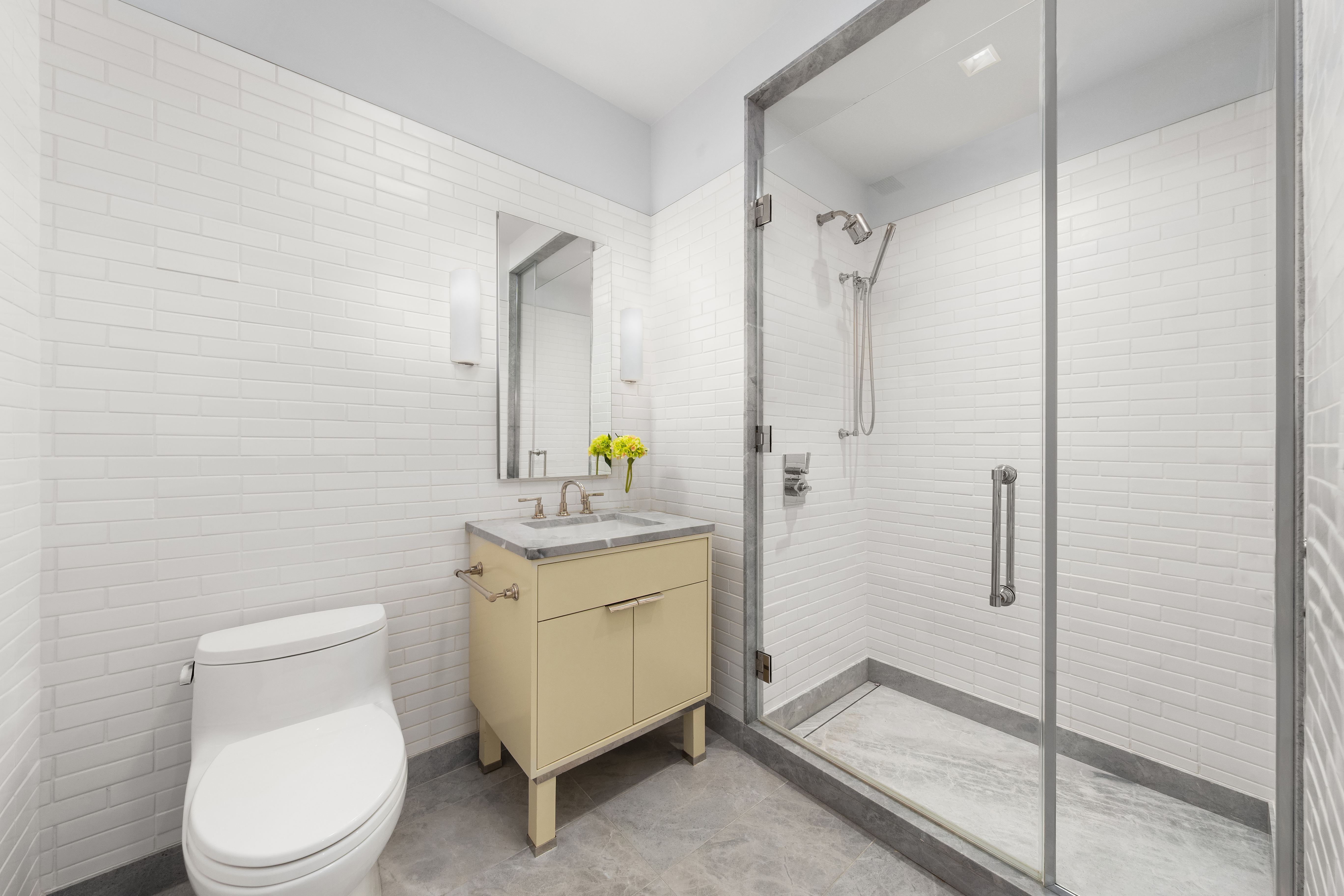 150 Charles Street, Unit 4AN Manhattan, NY 10014 - Photo 9 of 19 a bathroom with a granite countertop sink toilet and shower