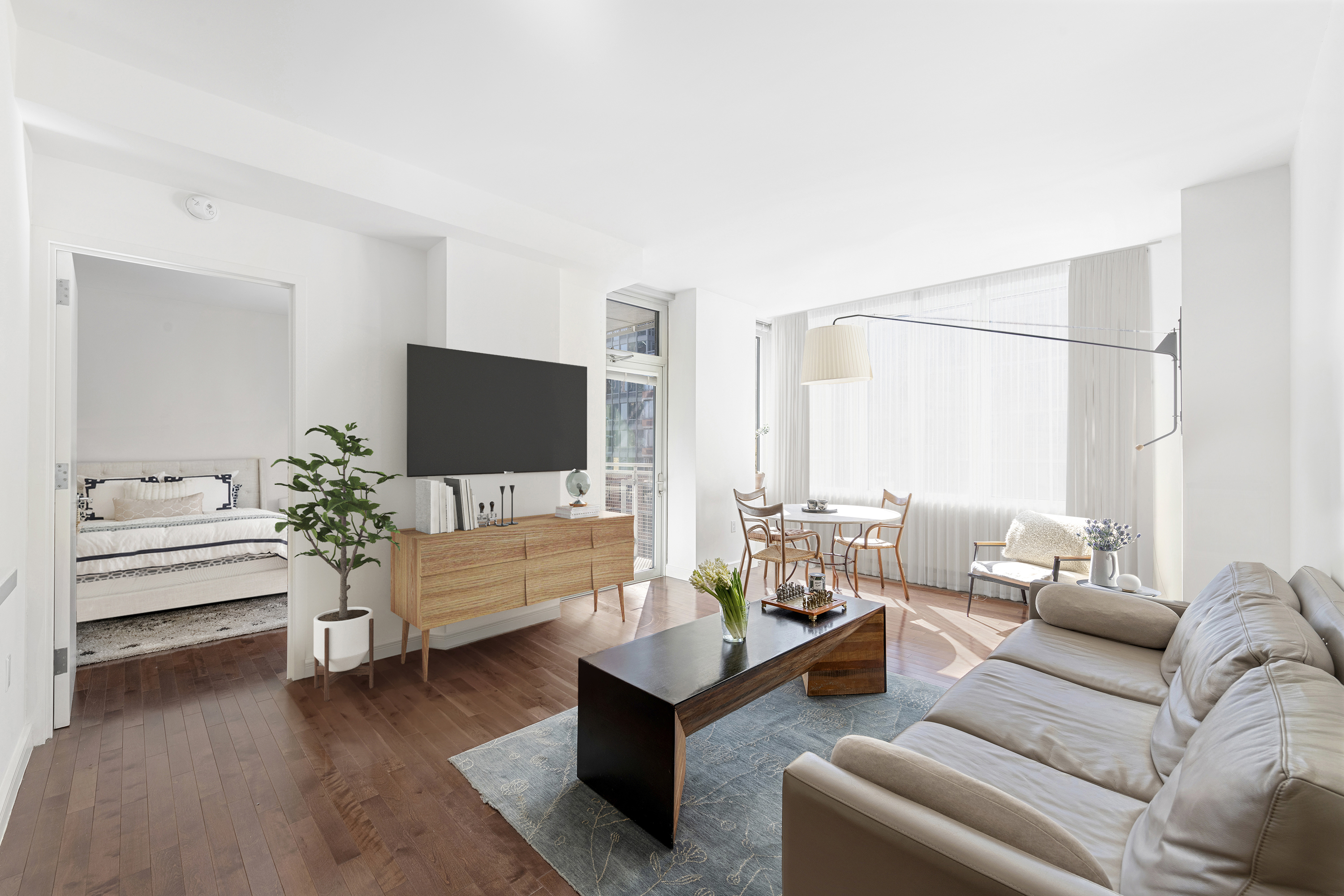 a living room with furniture and a flat screen tv