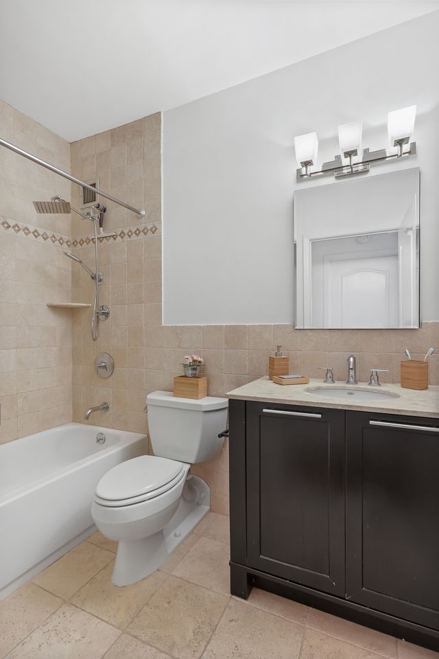 55 Poplar Street, Unit 2C Brooklyn, NY 11201 - Photo 8 of 14 a bathroom with a sink toilet and shower