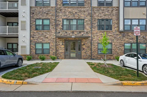 a view of a swimming pool with seating area