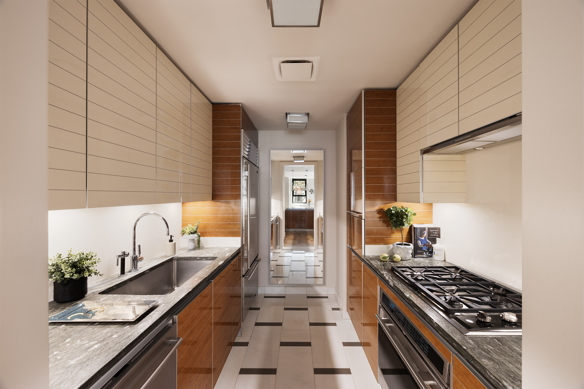 170 East End Avenue, Unit 2A Manhattan, NY 10128 - Photo 7 of 16 a kitchen with granite countertop stainless steel appliances and counter space