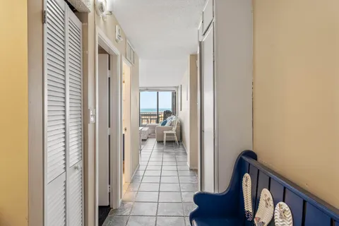 a view of a hallway and a livingroom with a hallway