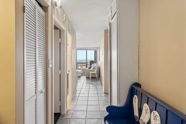 a view of a hallway and a livingroom with a hallway