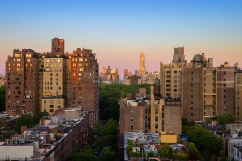 a view of a city with tall buildings