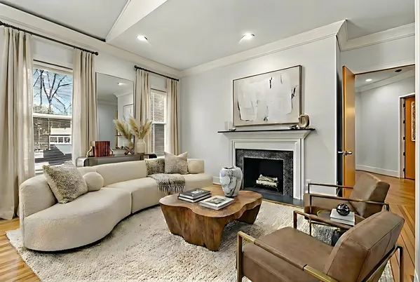 a living room with furniture and a fireplace