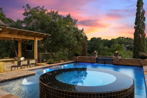 a view of a swimming pool with a patio