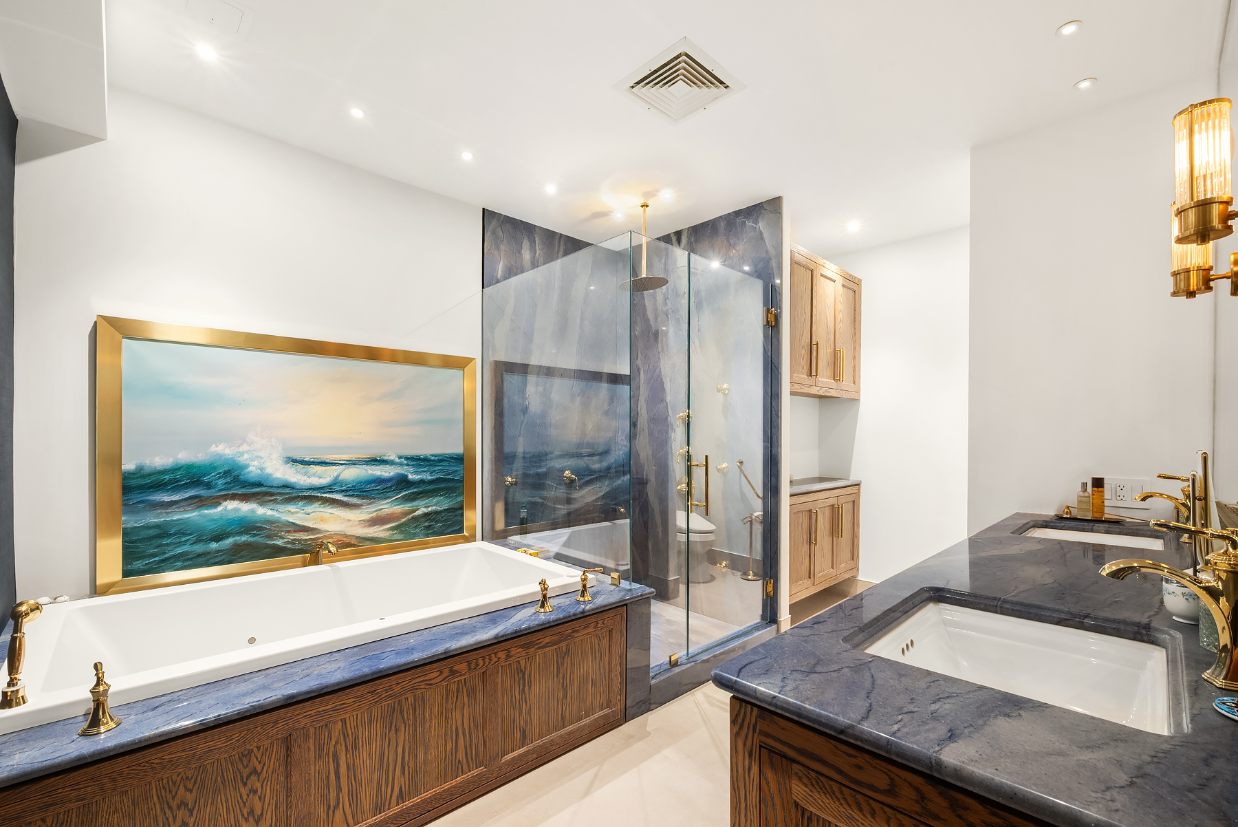 315 West 36th Street, Unit 11D Manhattan, NY 10018 - Photo 4 of 10 a kitchen with a sink and a large mirror