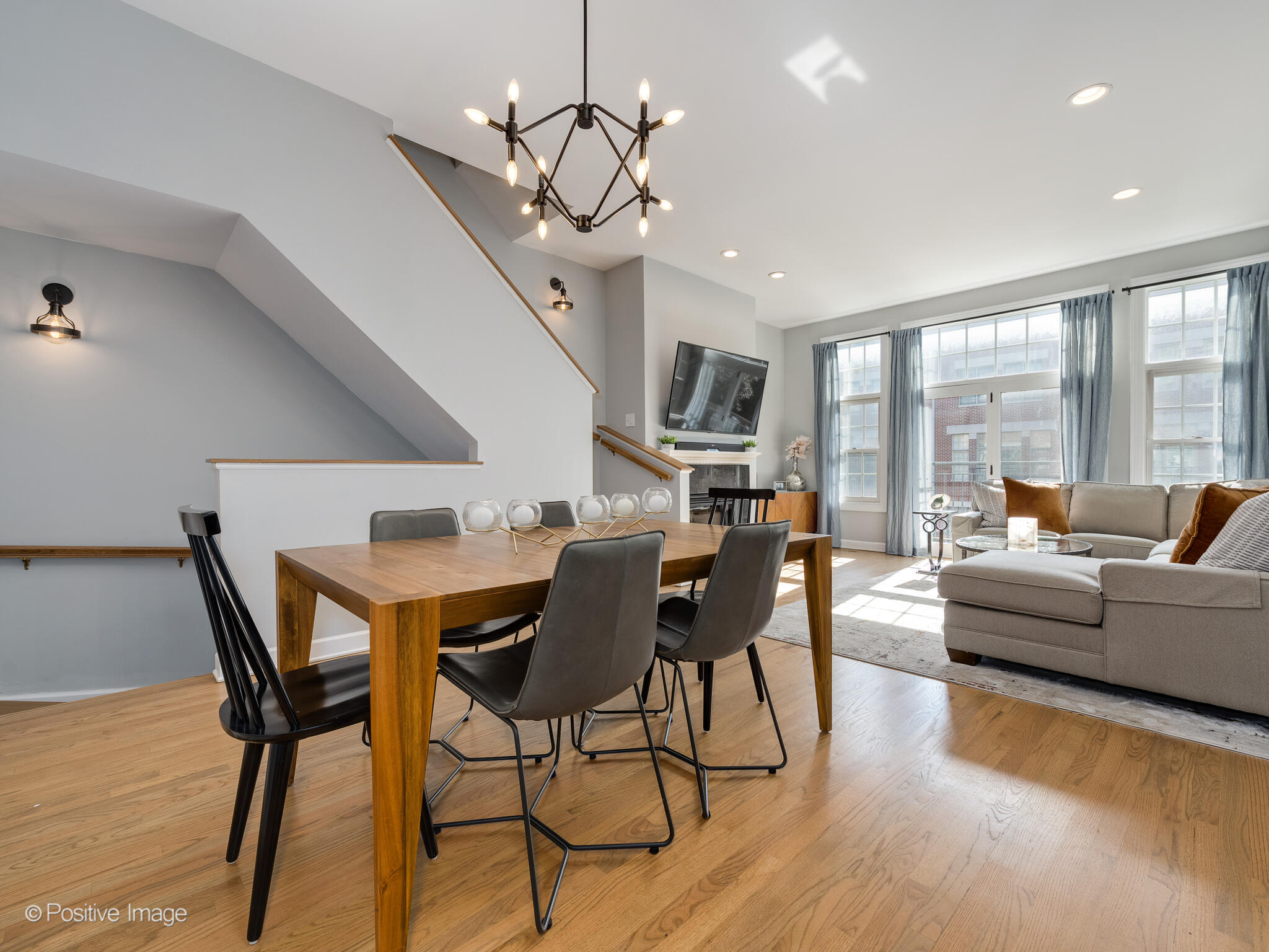 855 North May Street, Unit G Chicago, IL 60642 - Photo 6 of 28 a dining room with furniture a chandelier and wooden floor