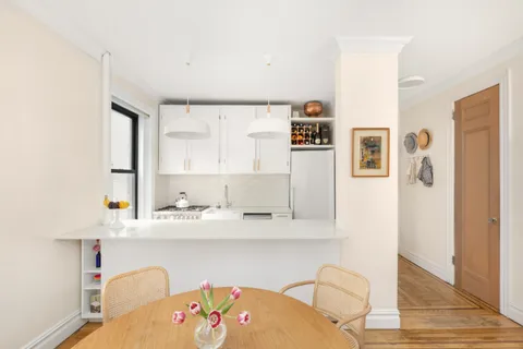 a bathroom with a sink a mirror and a toilet