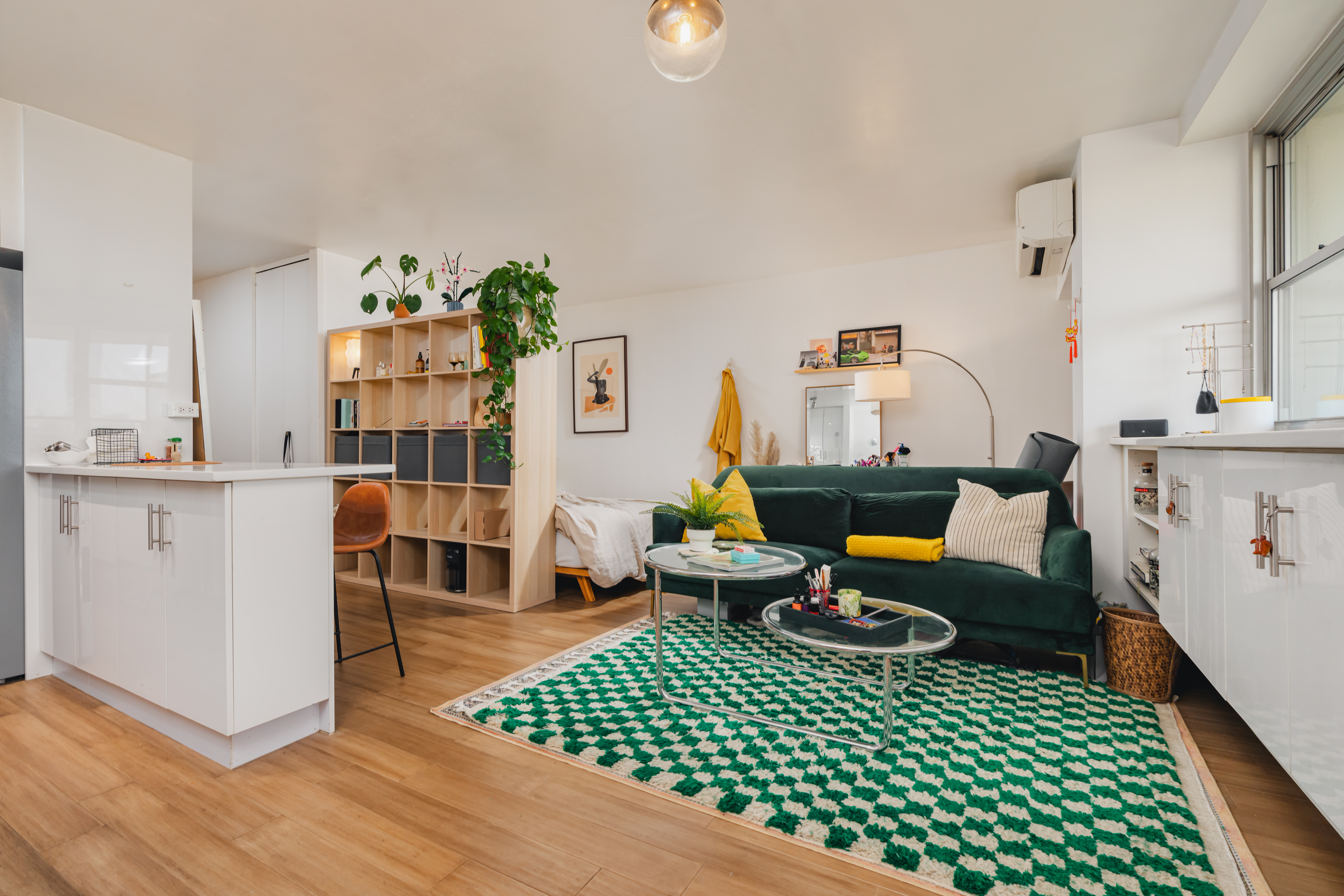 75 Henry Street, Unit 6D Brooklyn, NY 11201 - Photo 2 of 11 a living room with furniture a rug and a bookshelf