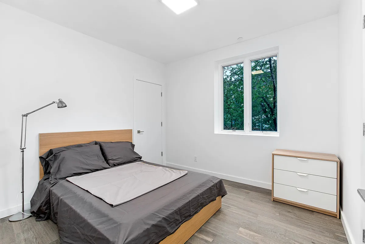 319 Broadway Brooklyn, NY 11211 - Photo 9 of 22 a bedroom with a bed and a window