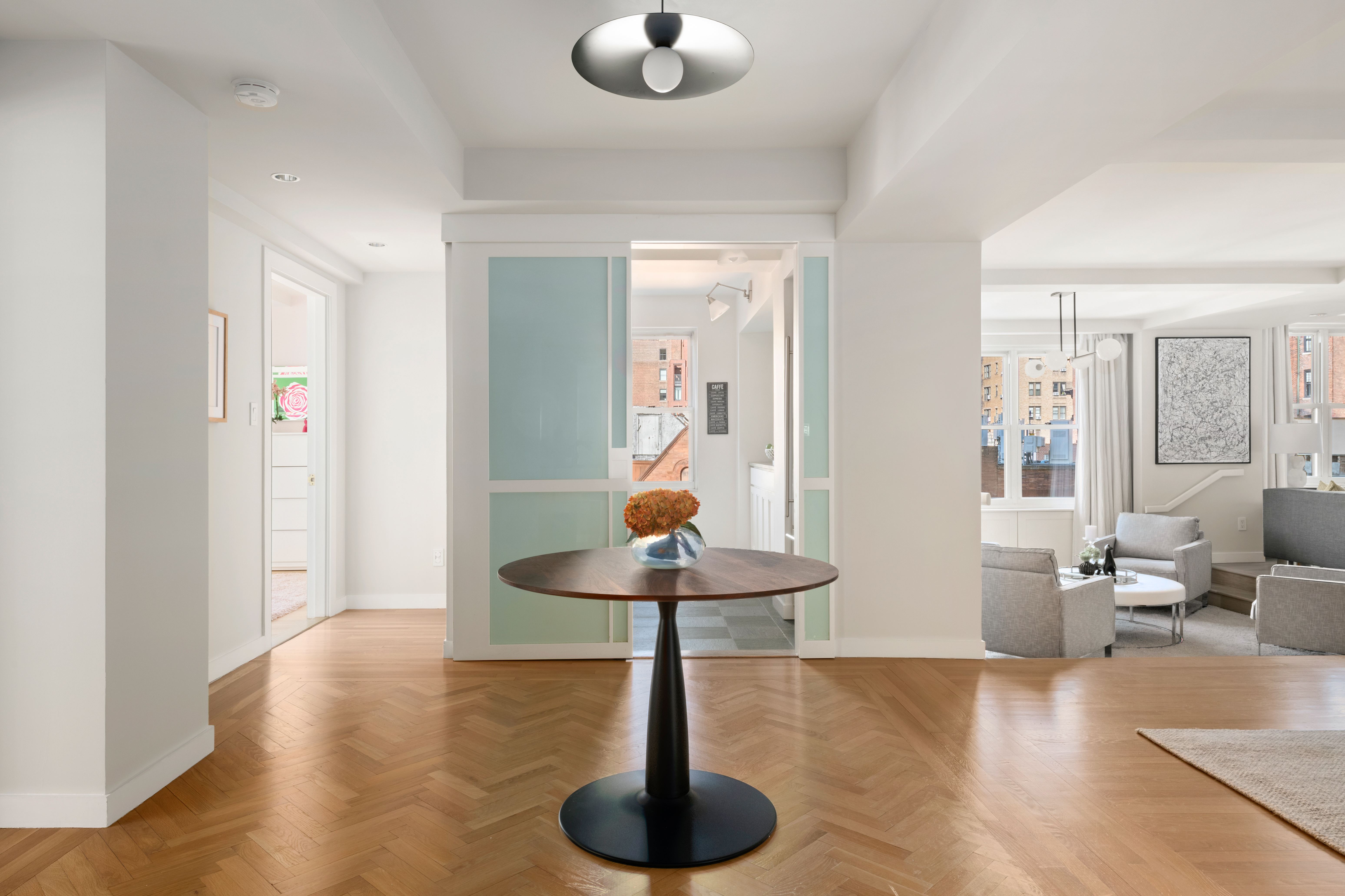 336 West End Avenue, Unit 7CD Manhattan, NY 10023 - Photo 4 of 16 a living room with furniture and a chandelier