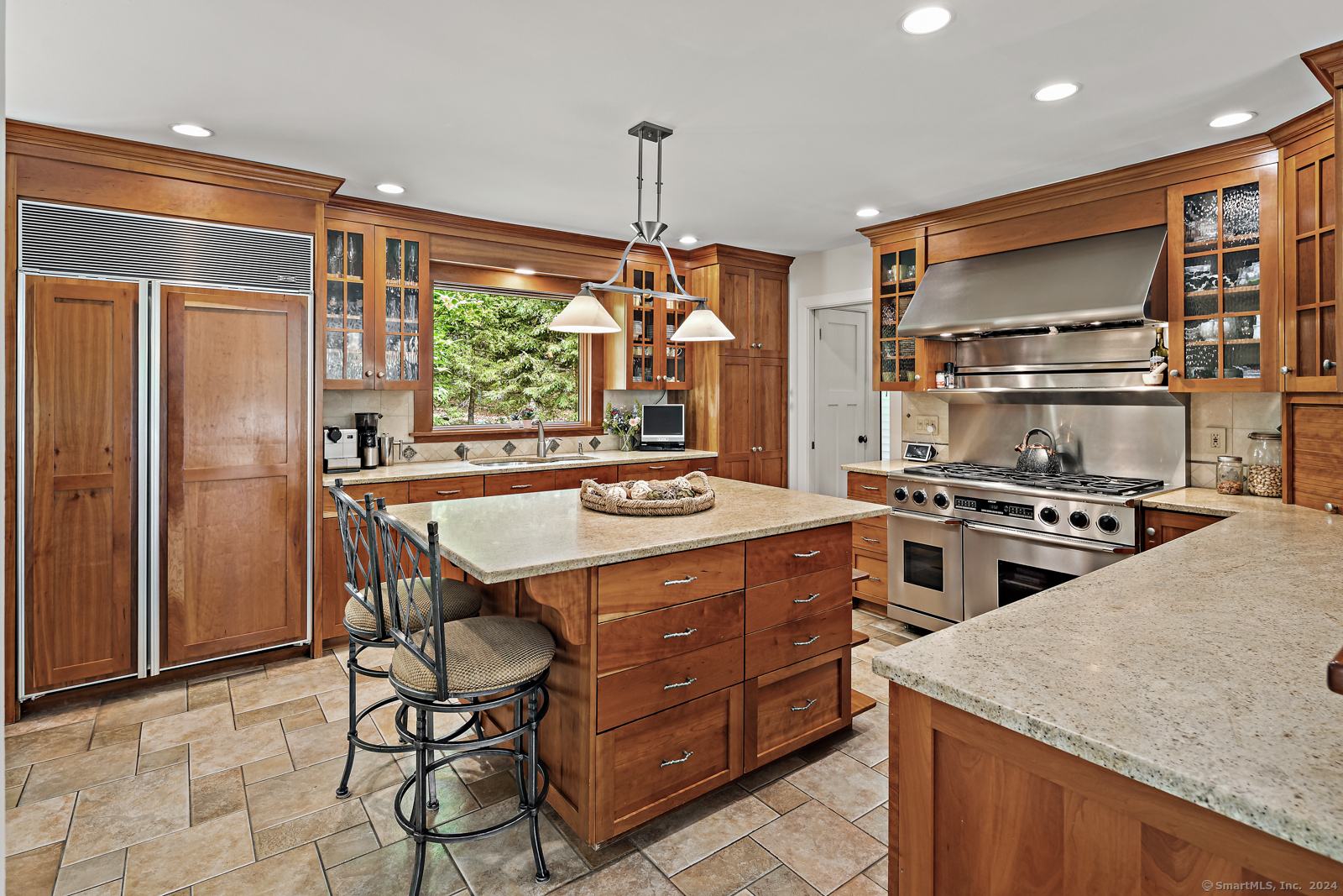 13 Bittersweet Road Weston, CT 06883 - Photo 6 of 35 a kitchen with stainless steel appliances granite countertop a sink a stove and a refrigerator