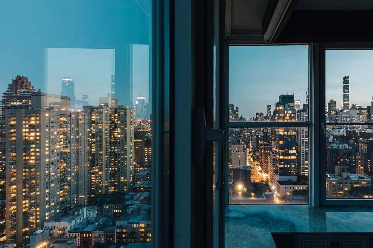 404 East 76th Street, Unit 30C Manhattan, NY 10021 - Photo 5 of 24 a view of a balcony with next to door and wooden floor