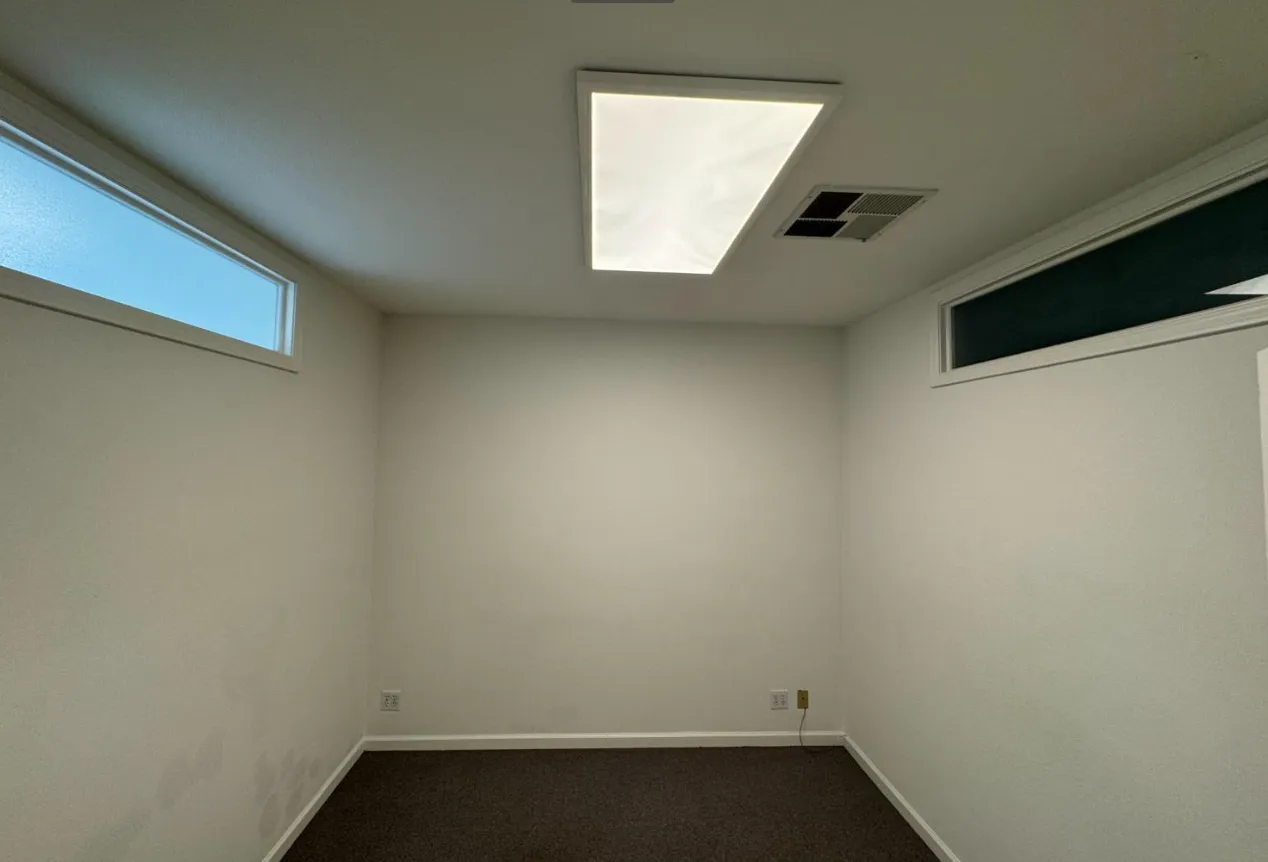 an empty room with windows