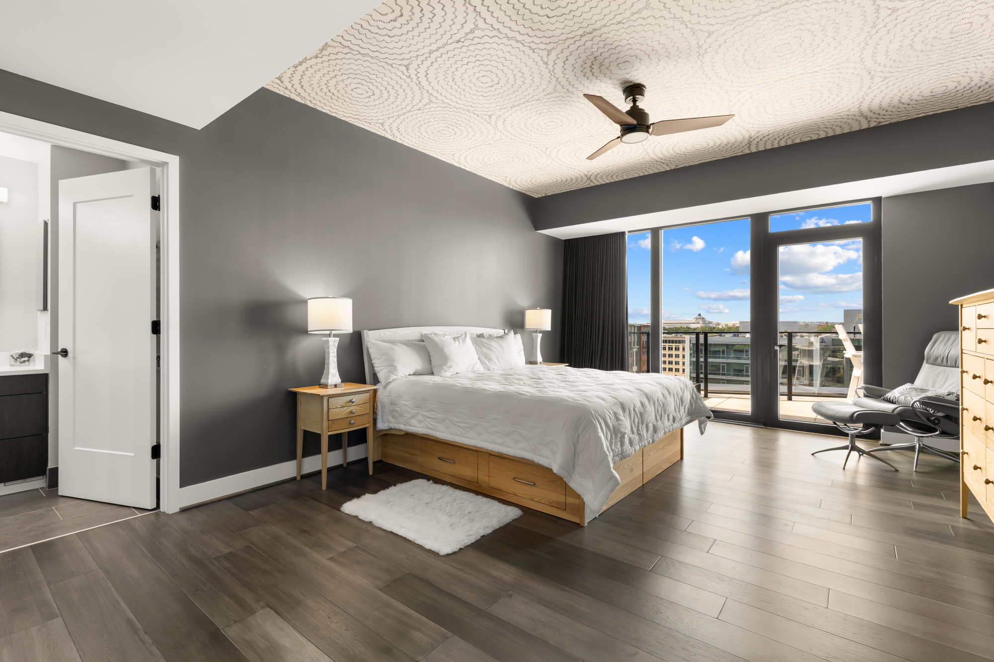 1300 4th Street Southeast, Unit PH02 Washington, DC 20003 - Photo 17 of 38 a bedroom with a bed and wooden floor