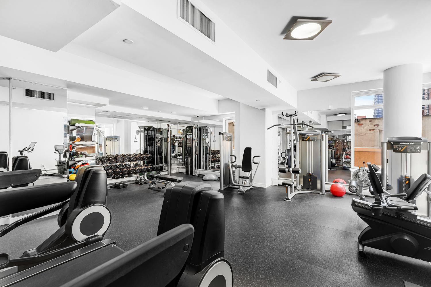 205 East 59th Street, Unit 19A Manhattan, NY 10022 - Photo 10 of 14 a view of a room with gym equipment