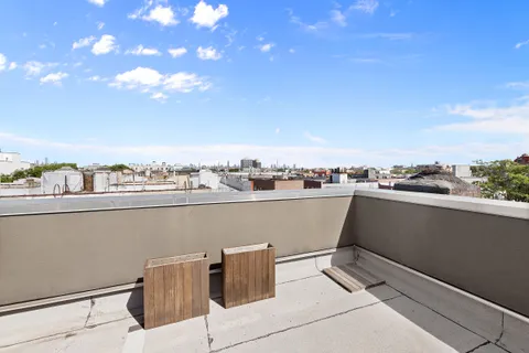 a view of roof deck with seating space