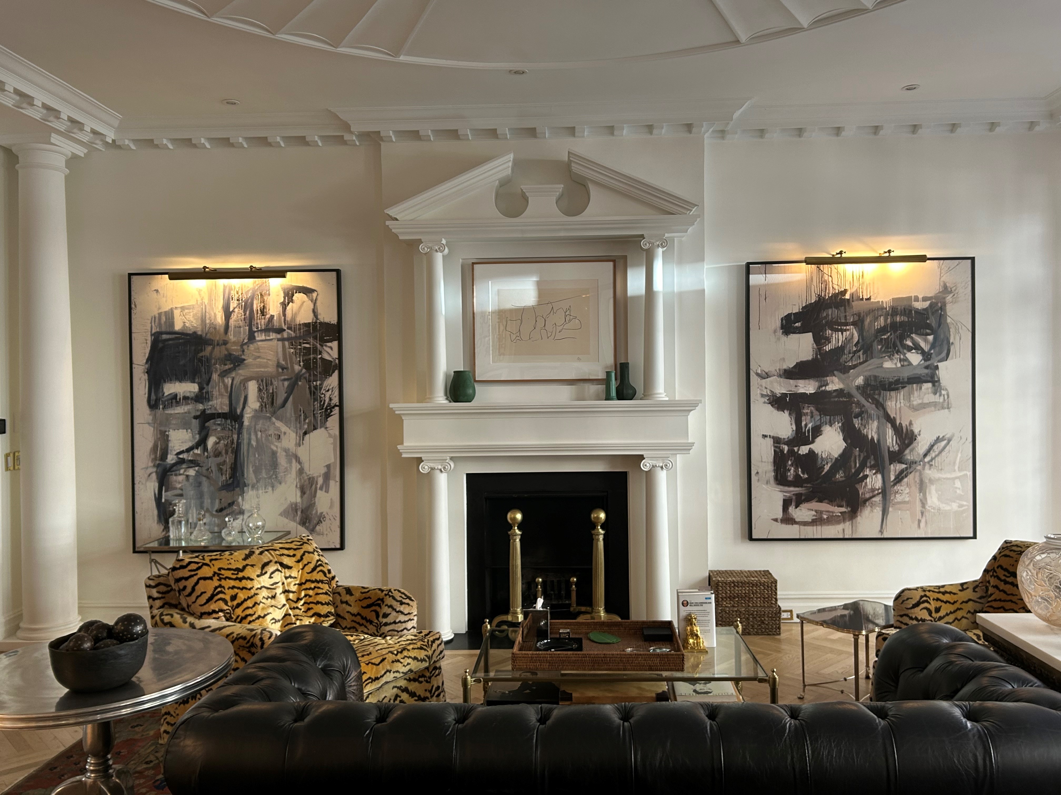 36 East 69th Street, Unit 2AB Manhattan, NY 10021 - Photo 12 of 26 a living room with furniture and a fireplace