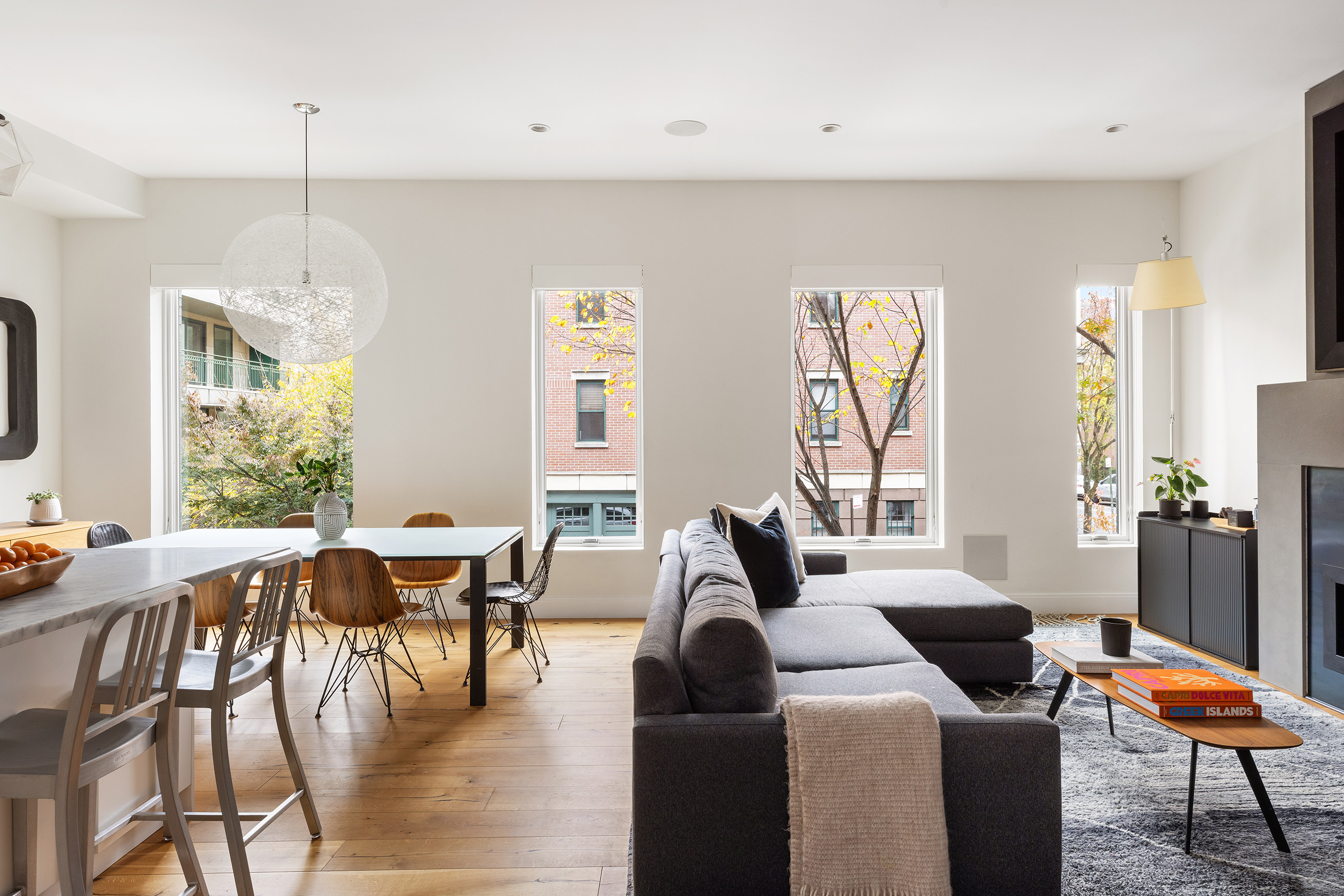 43 Dean Street Brooklyn, NY 11201 - Photo 2 of 17 a living room with furniture a dining table and a floor to ceiling window