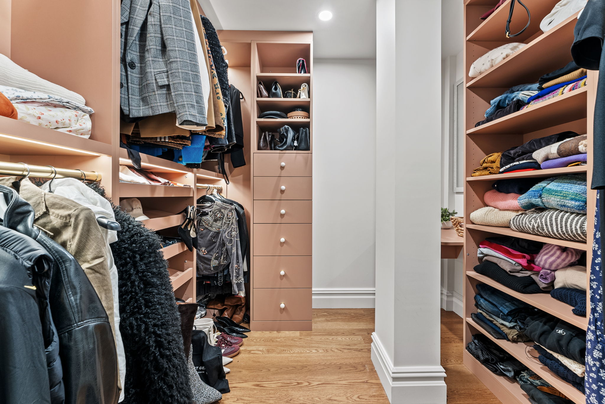 230 Central Park South, Unit 6DE Manhattan, NY 10019 - Photo 17 of 23 a view of walk in closet with clothes and shoes
