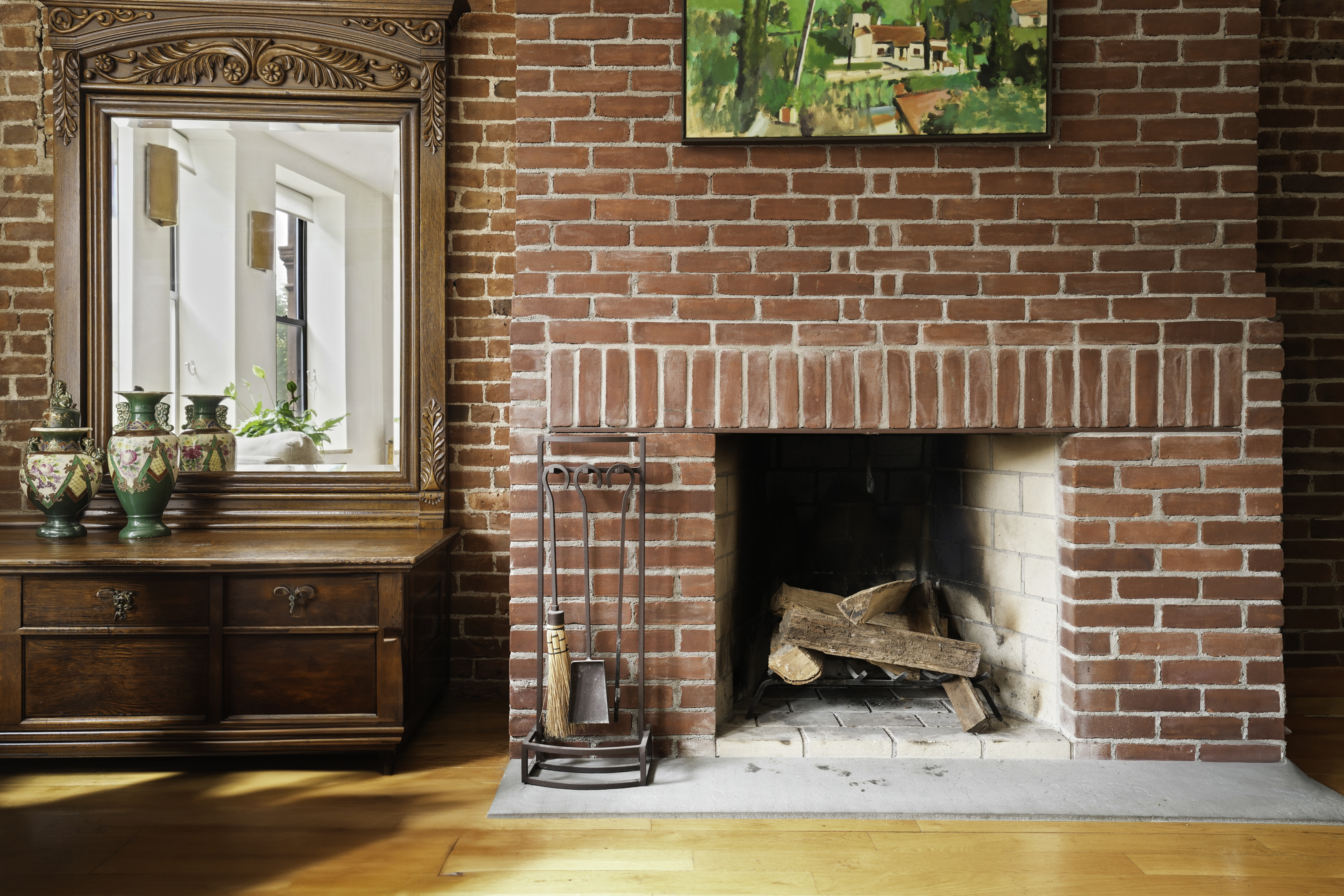 109 West 118th Street Manhattan, NY 10026 - Photo 11 of 31 a living room with a fireplace