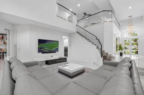 a kitchen with stainless steel appliances a sink a stove a refrigerator and cabinets