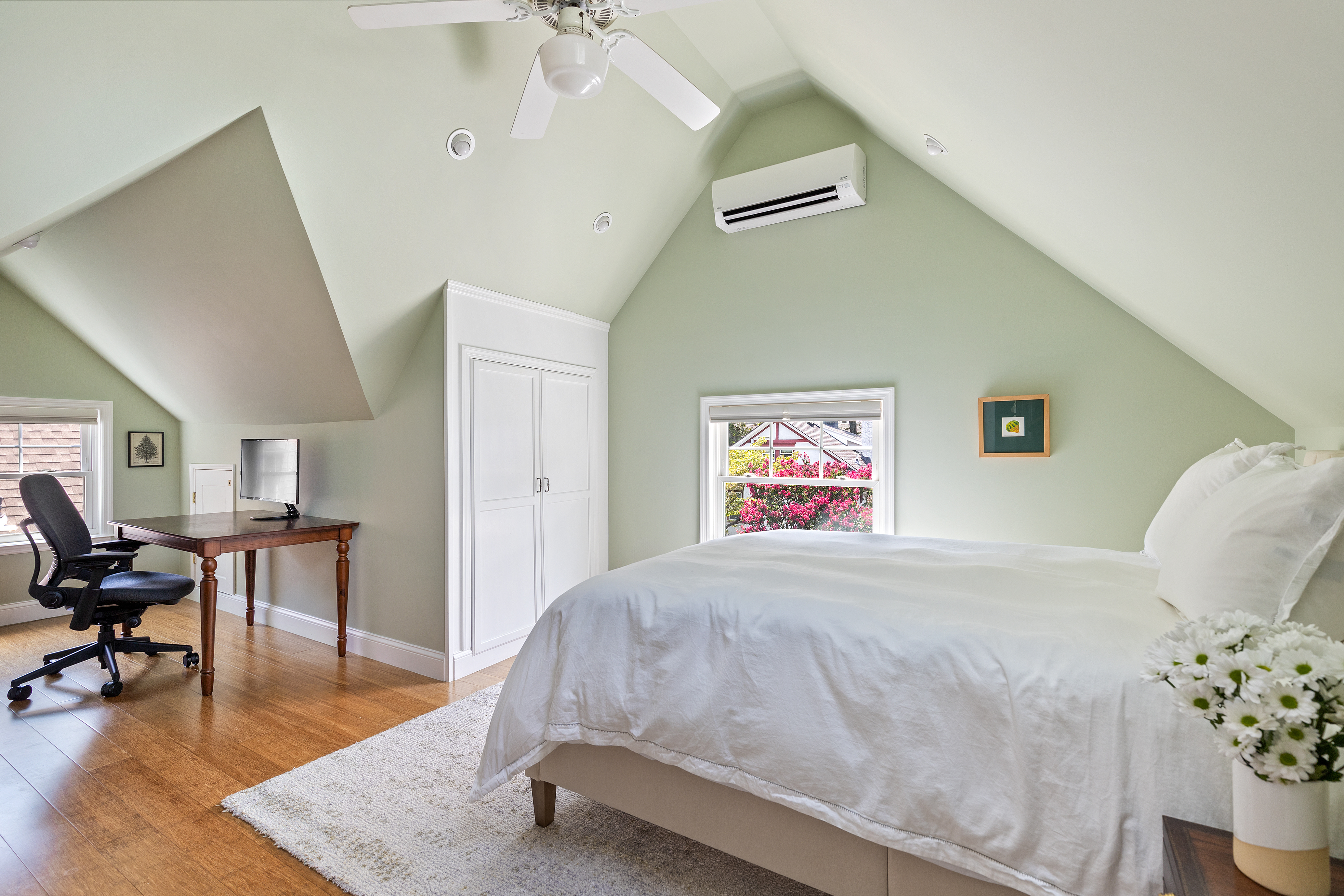 498 Westminster Road Brooklyn, NY 11218 - Photo 25 of 32 a spacious bedroom with a bed and a table in it