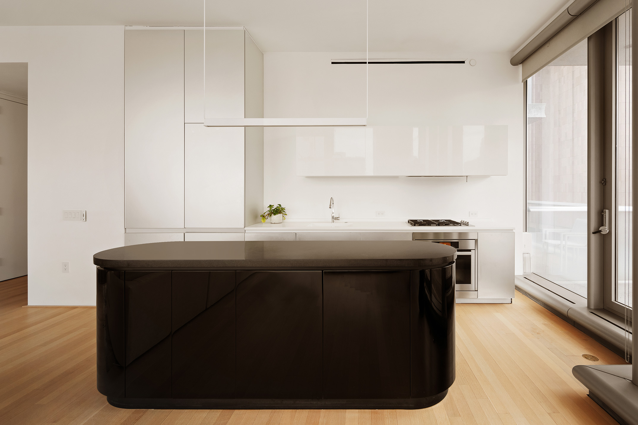 56 Leonard Street, Unit 21AWEST Manhattan, NY 10013 - Photo 3 of 11 a kitchen with a sink a stove and a refrigerator