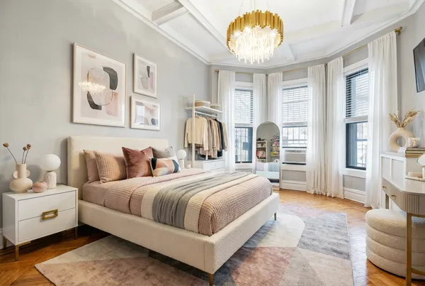 a bedroom with bed and window