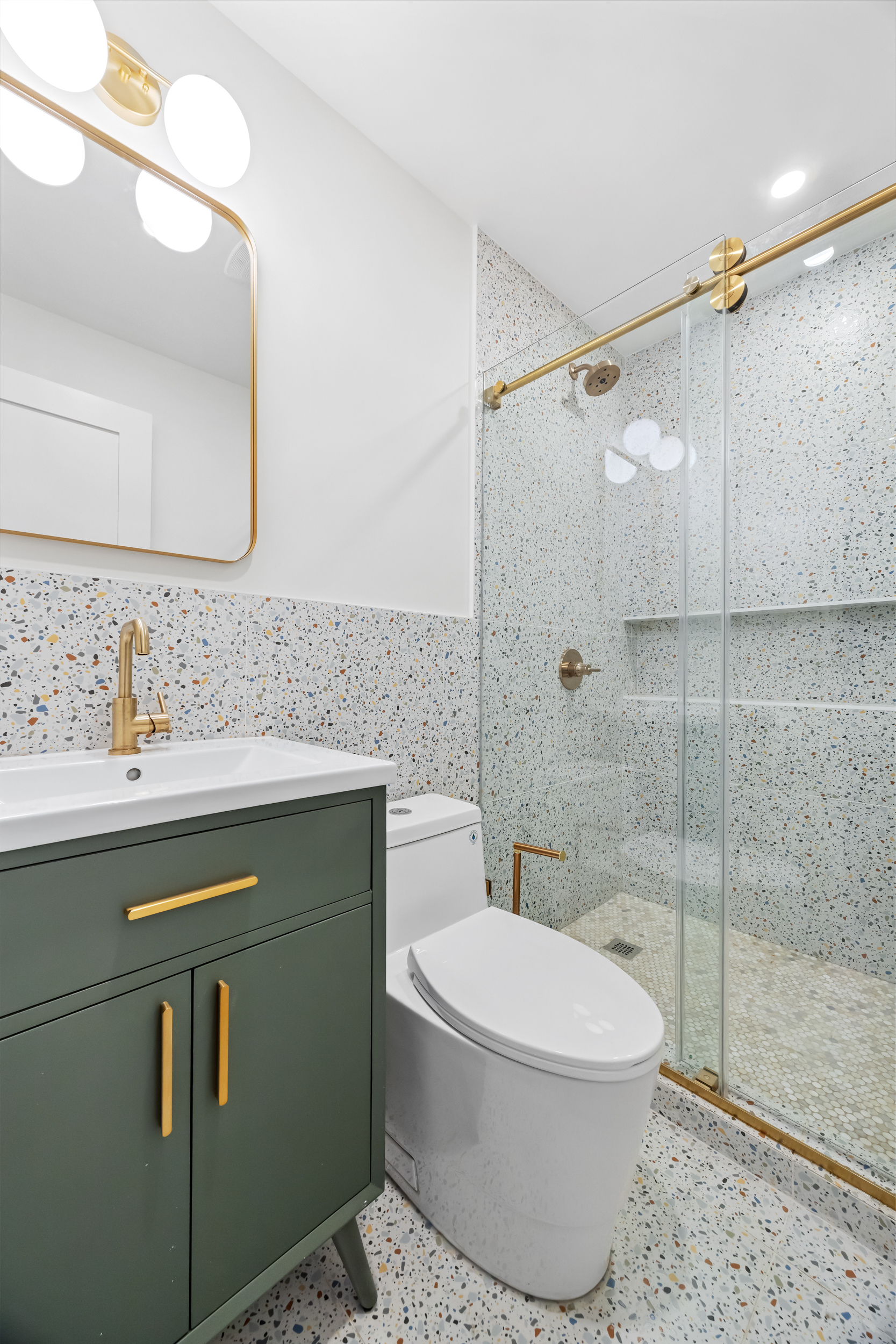 544 Madison Street, Unit A Brooklyn, NY 11221 - Photo 14 of 17 a bathroom with a sink toilet and shower