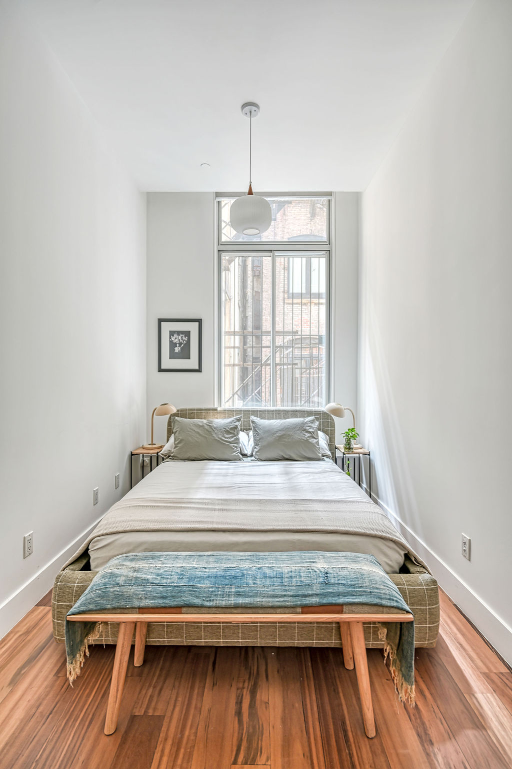 42 East 12th Street, Unit 2 Manhattan, NY 10003 - Photo 11 of 18 a bedroom with a bed and a window