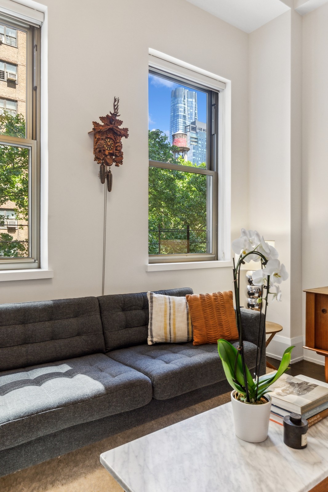 263 9th Avenue, Unit 3D Manhattan, NY 10001 - Photo 3 of 15 a living room with furniture and a window