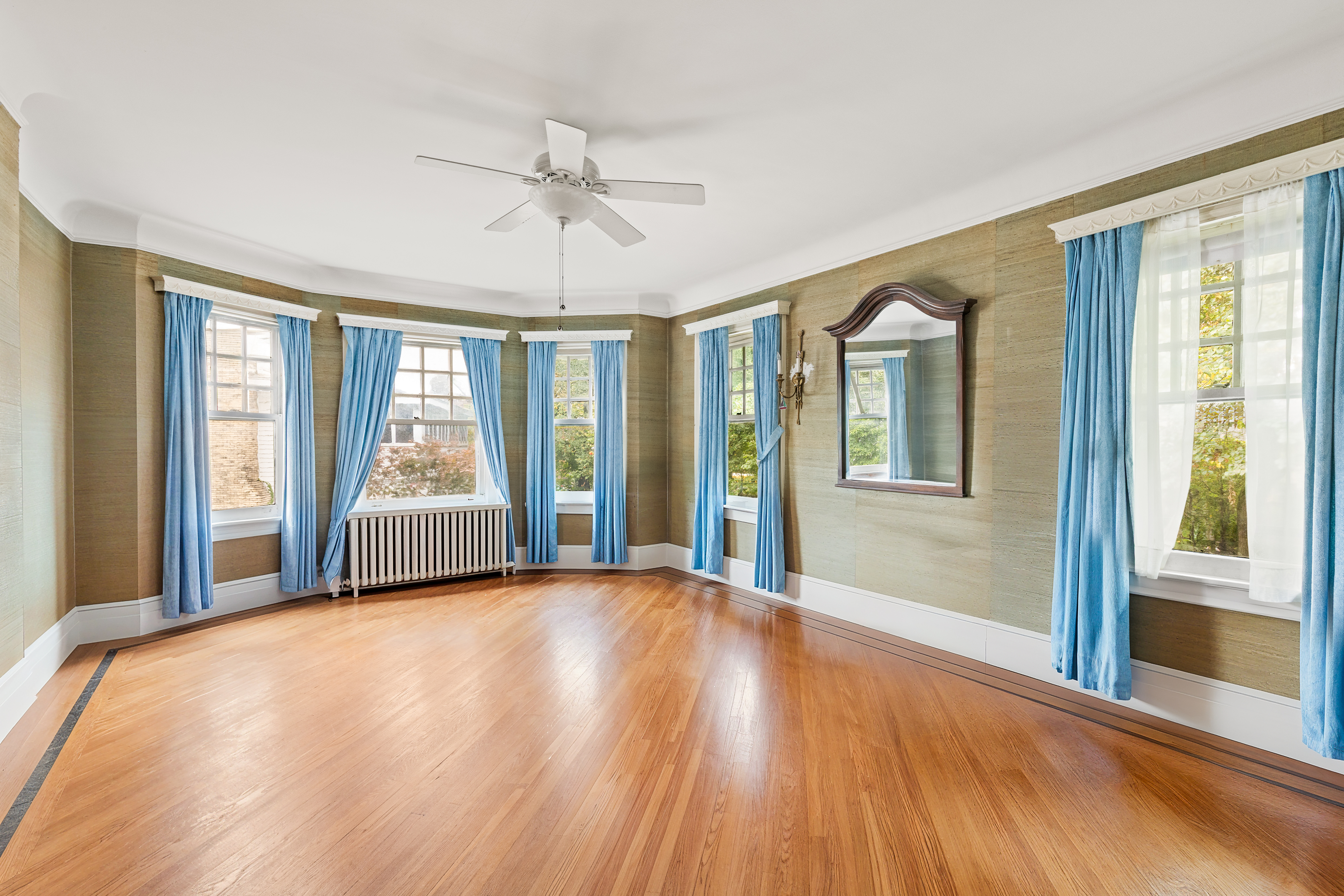 1917 Ditmas Avenue Brooklyn, NY 11226 - Photo 9 of 13 a view of a bedroom with wooden floor and windows
