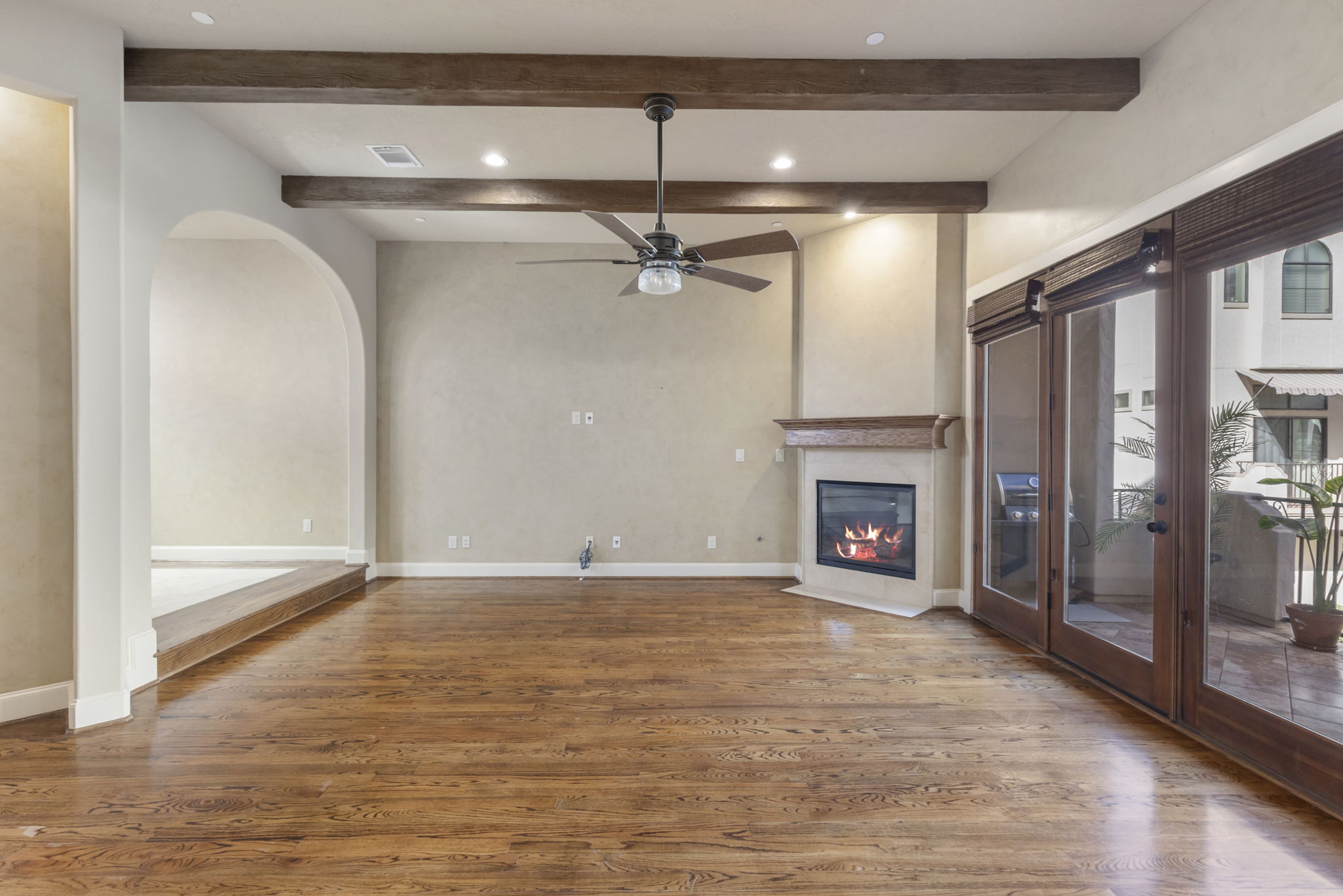 5407 Feagan Street Houston, TX 77007 - Photo 7 of 43 a view of an empty room with a fireplace and a window
