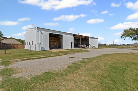 a view of a porch with furniture and a shower