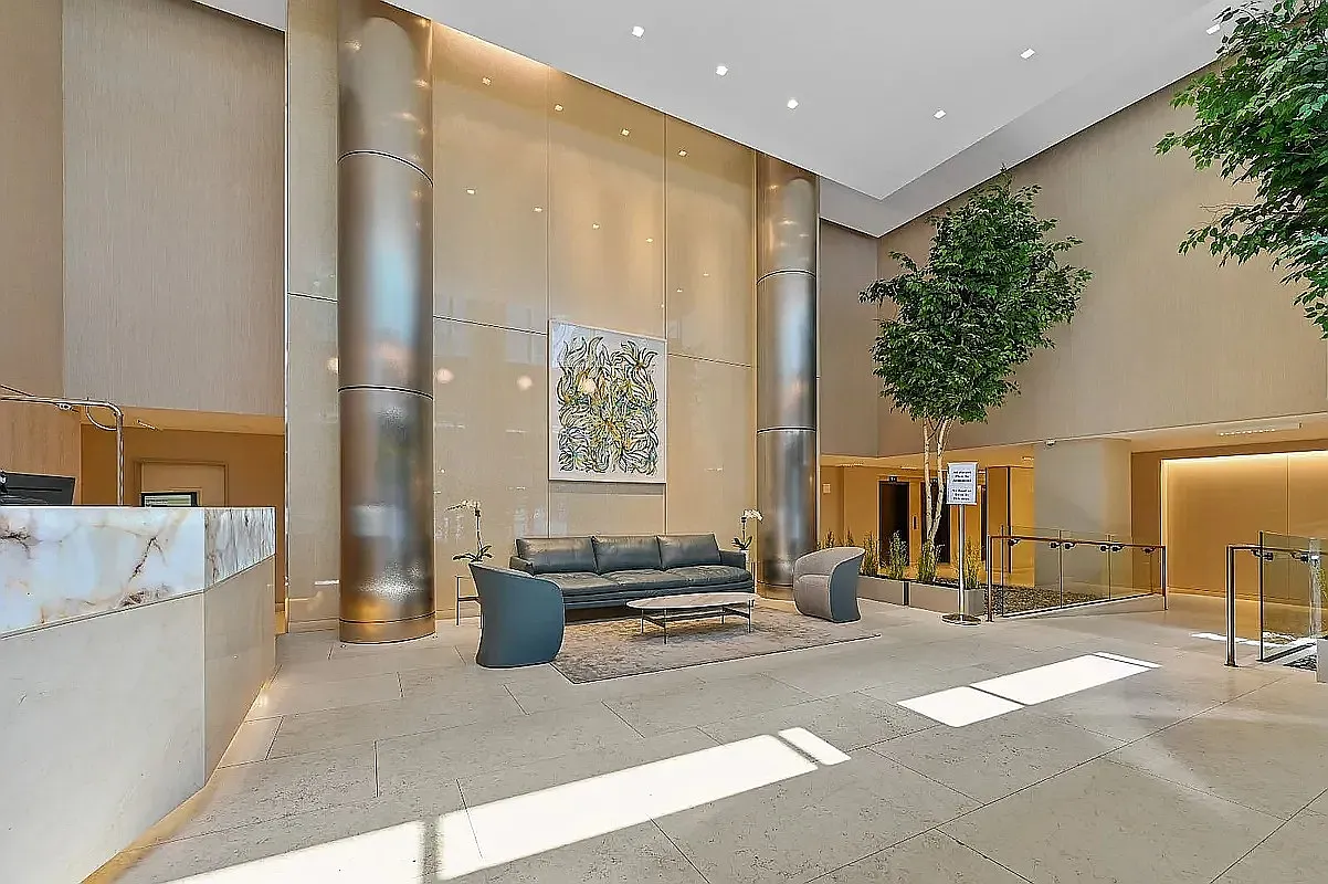 275 West 96th Street, Unit 12B Manhattan, NY 10025 - Photo 17 of 28 a bedroom with a large bed and a chandelier