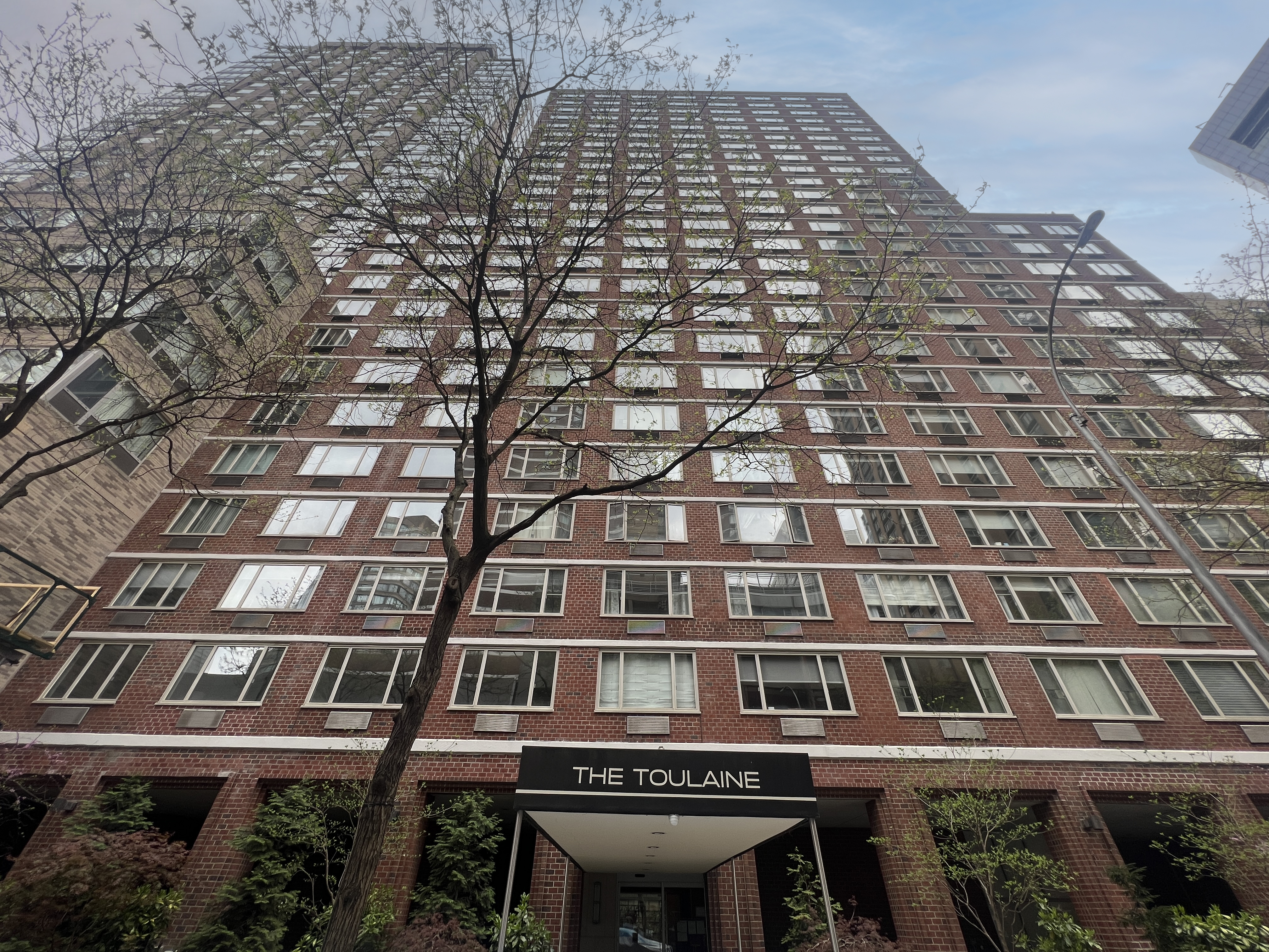 130 West 67th Street, Unit 2E Manhattan, NY 10023 - Photo 10 of 11 a front view of a building with balcony