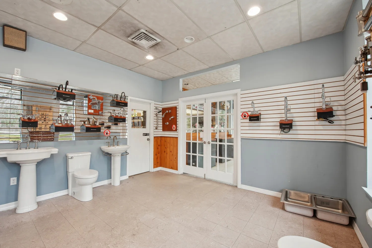 a kitchen with refrigerator and sink