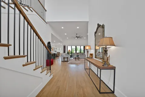 a view of entryway and hall with wooden floor
